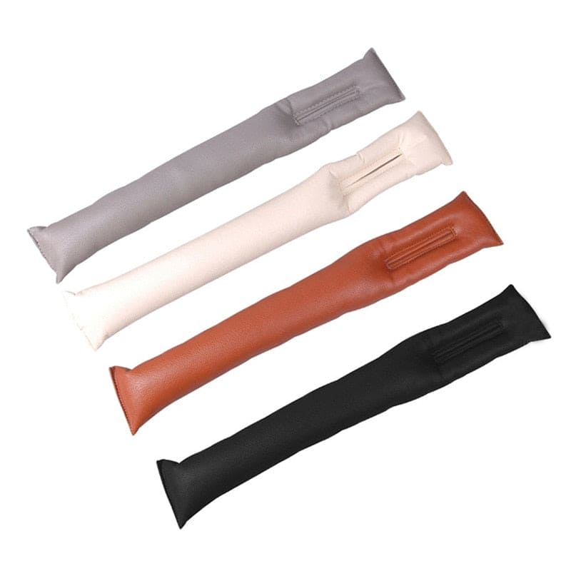 Four AutoSavvy GapGuard leather wedges in black, brown, gray and beige, designed to fit between car seats and the center console. This cool car accessory prevents items from falling, enhancing safety and organization. Easy to install and fits most cars, perfect for car hacks and maintaining a clean interior."